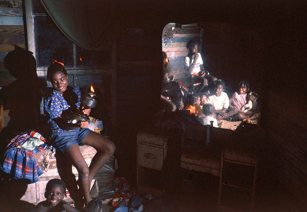 After digging in the river bank for  sweet dirt  one afternoon, the cousin of these children took me home to eat the supper of red clay 