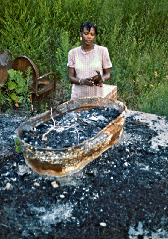 Mary at her house after the firebombing   