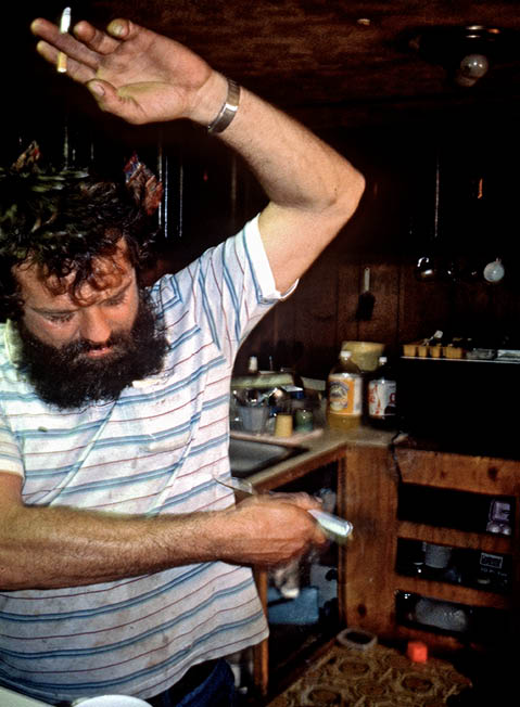 John demonstrating how he twisted the knife in the black man