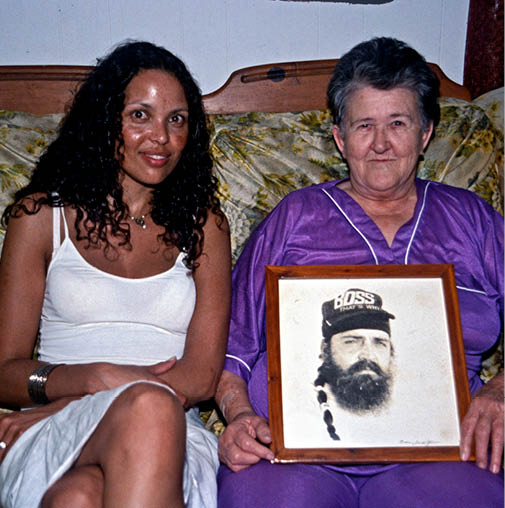 Rose showing her picture of her son Sammy in prison to Rikke Marott