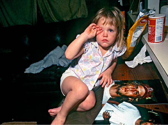 Angel at two with her uncle Woody who later raped her