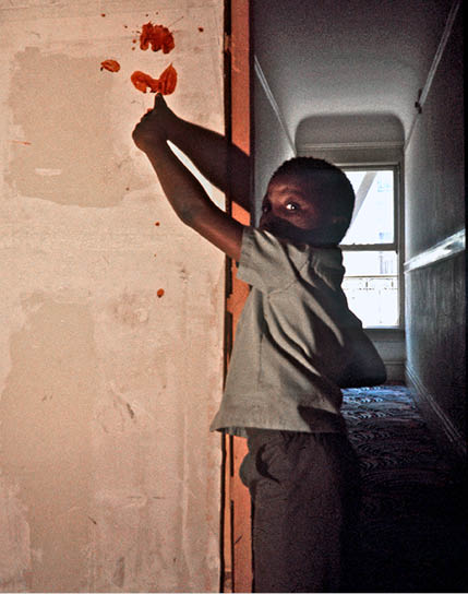 Boy showing where his family member was killed - 1975 SF