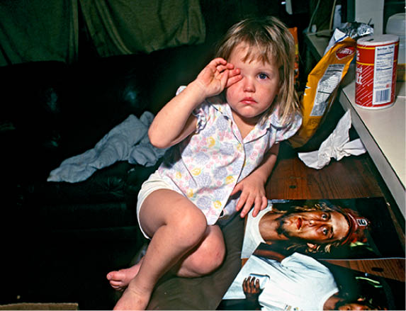 Angel at two with her uncle Woody who later raped her
