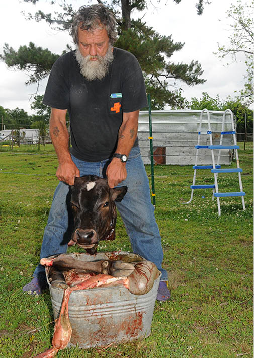 John showing how the lawn got red from blood in 2009