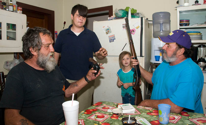 John with his stepson and grandchild Connie showing the guns he used for the killing the night before