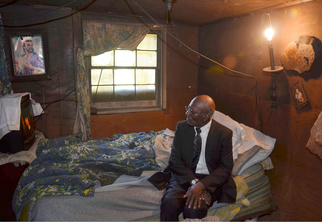 2012 - Preacher relaxing in his shack after church, Perry County, AL 
