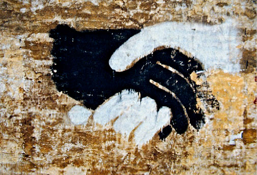 Painting of black white hands shaking hands