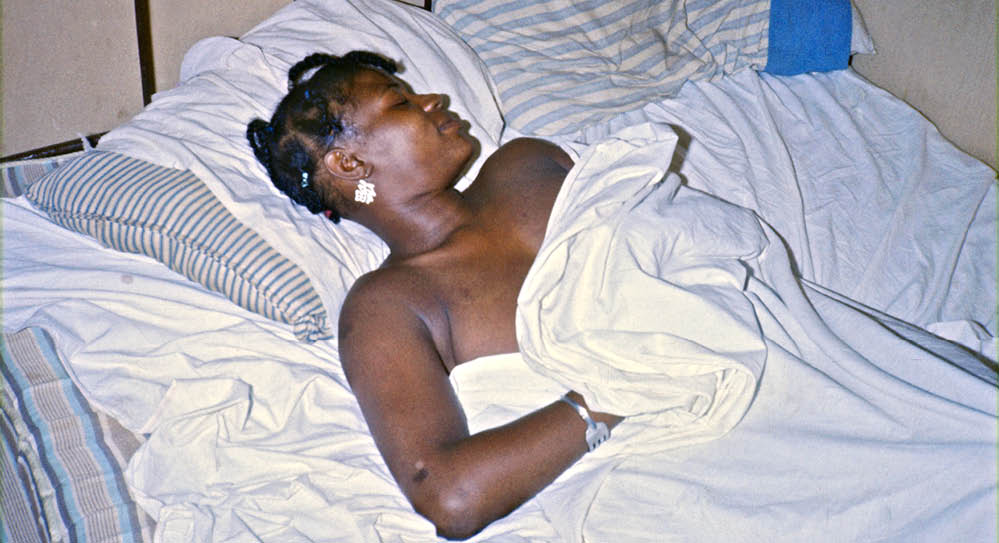 Mary at night in her shack on the forest backroads in Bullock County, 1974 