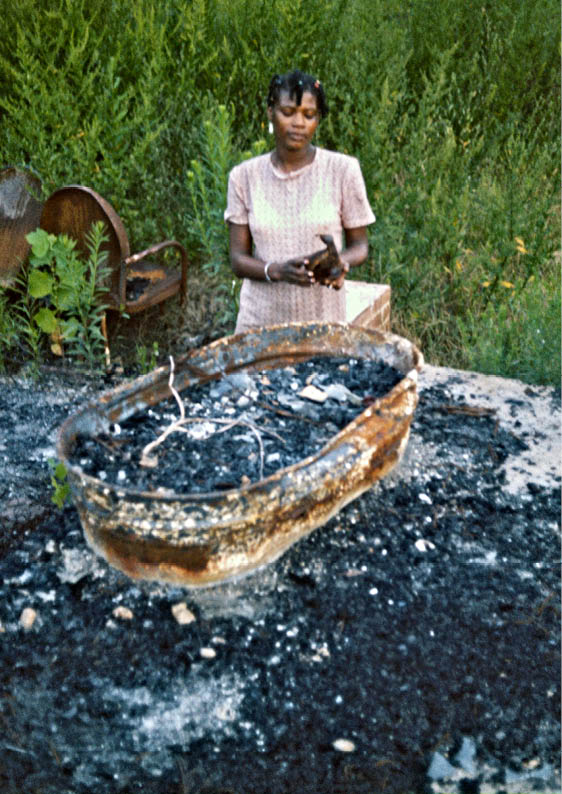 Mary at her house after the firebombing   