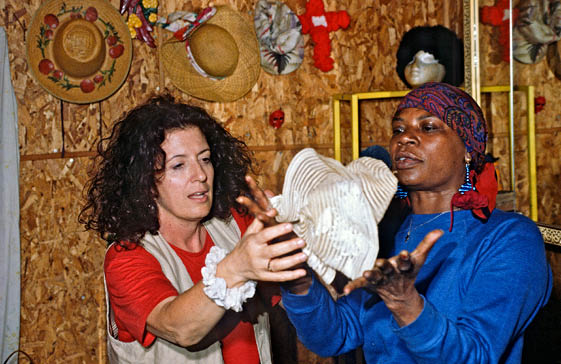 Mary showing Anita Roddick the hats and quilts she makes 1994  