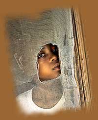 Black child in poverty - a victim of racism and social injustice. Click on all photos and reviews for enlargements and full text