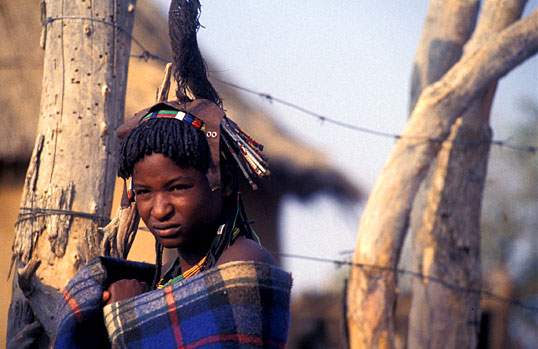 Non-Himba girl from neighboring tribe visits Himba