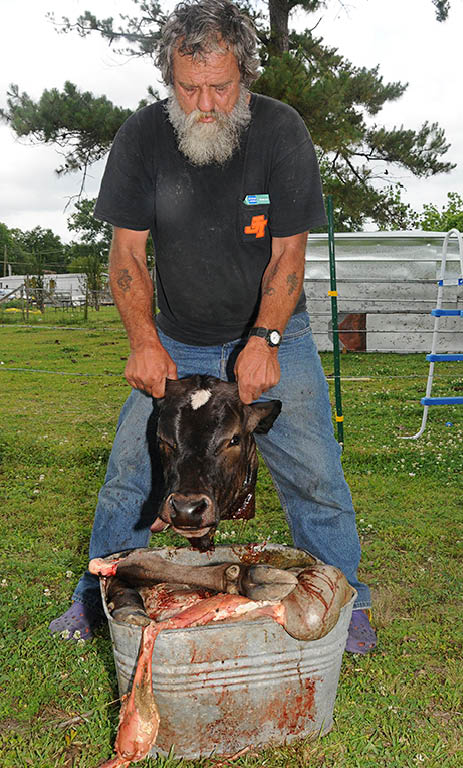 John showing how the lawn got red from blood in 2009
